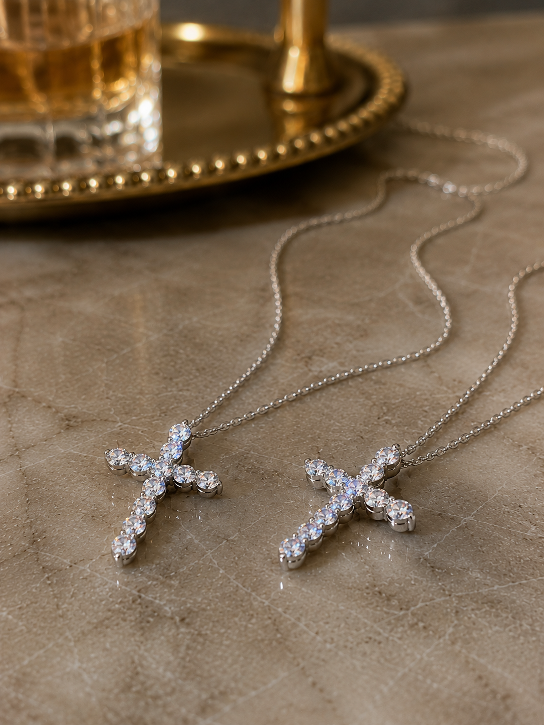 Small Cross Necklace on marble